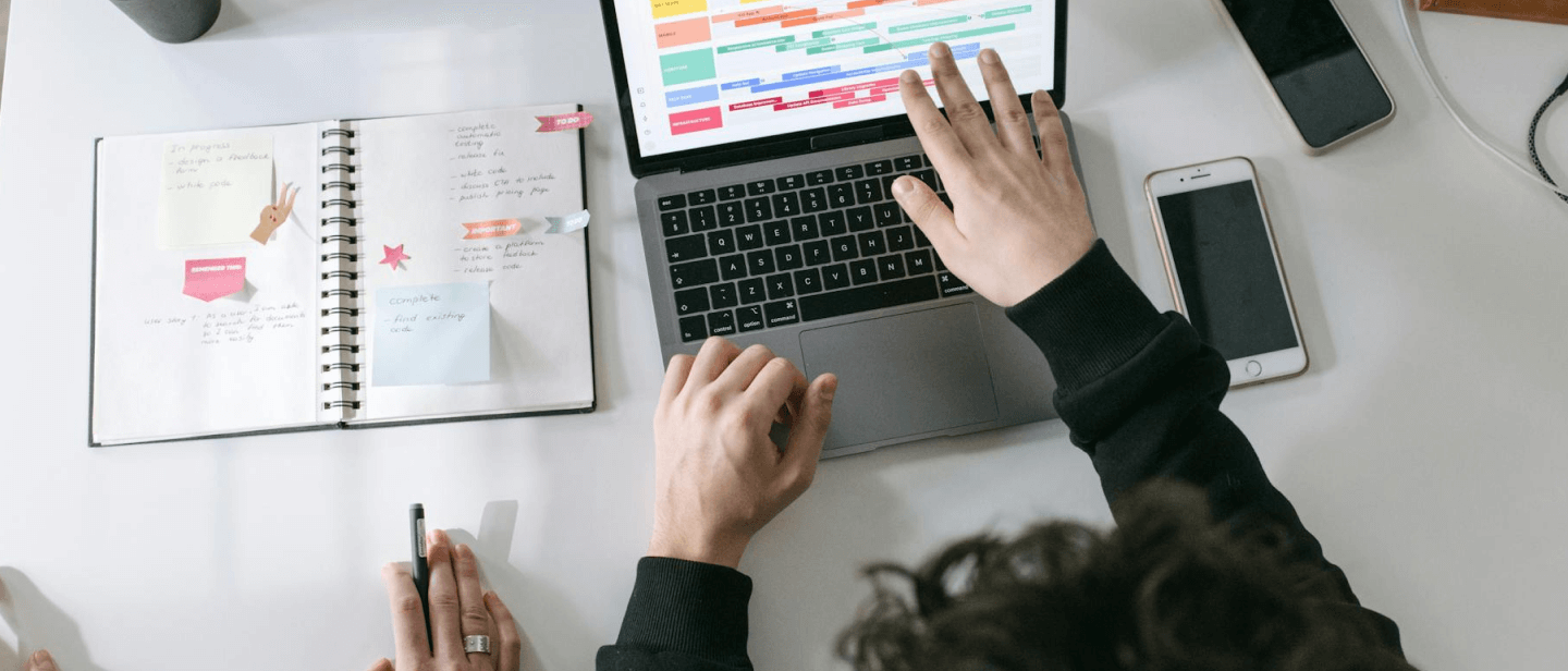 laptop open with software showcasing timelines
